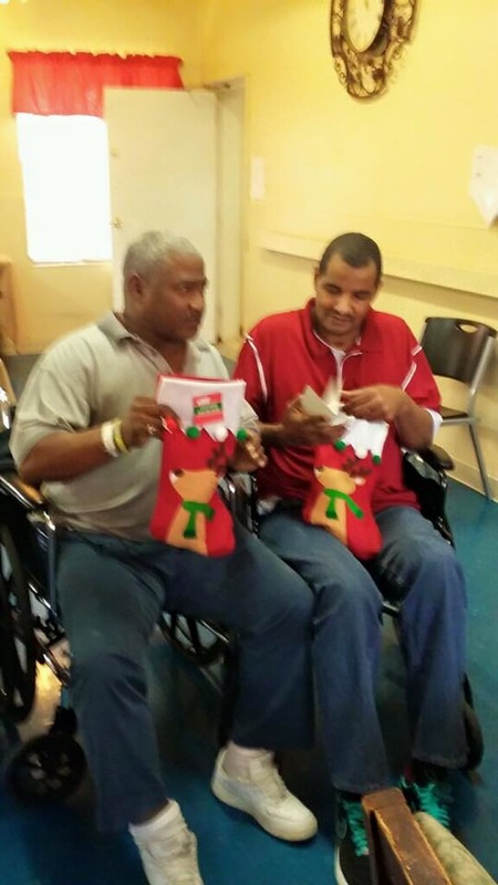 Nursing home residents opening their holiday stockings